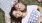 a man and woman lying in the grass