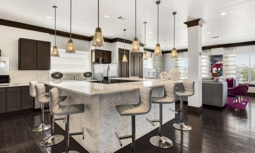 a kitchen with a table and chairs