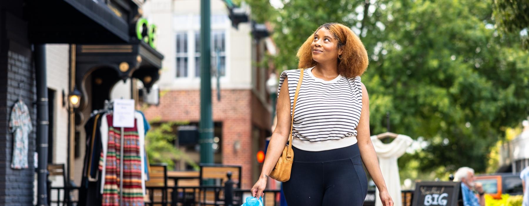 a person walking down a sidewalk