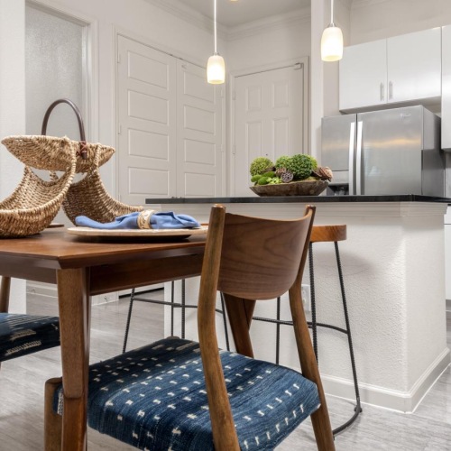a kitchen with a table and chairs