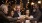 a group of people sitting at a table with drinks