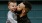 father holds and kisses his toddler son